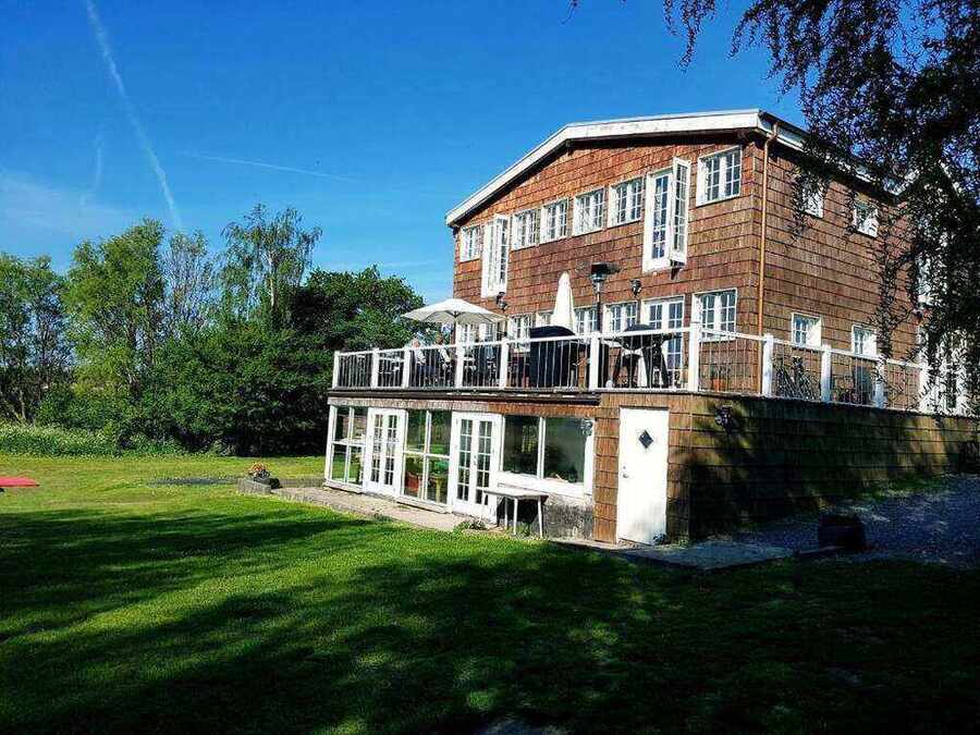 Stege Nor hotel building with garden terrace